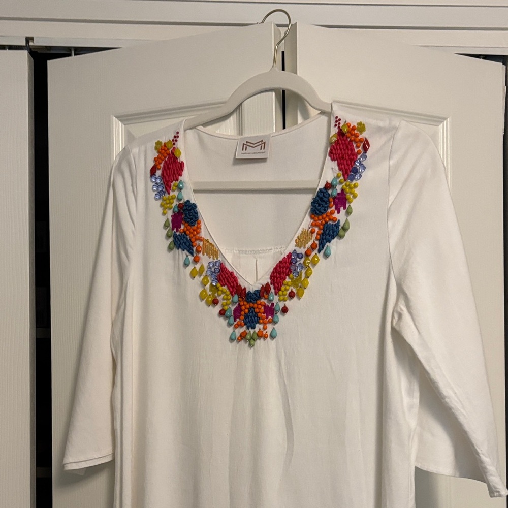 White dress/bathing suit cover with a Colorful bead Neckline.